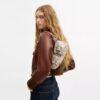 Ashton-schoudertas met krantenprint