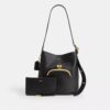 Bleecker-bucketbag met Kisslock