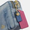 Carey-crossbodytas in 'Loved Denim' met bedels