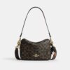 Carey-crossbodytas van het ‘Loved’ Signature Canvas met bedels