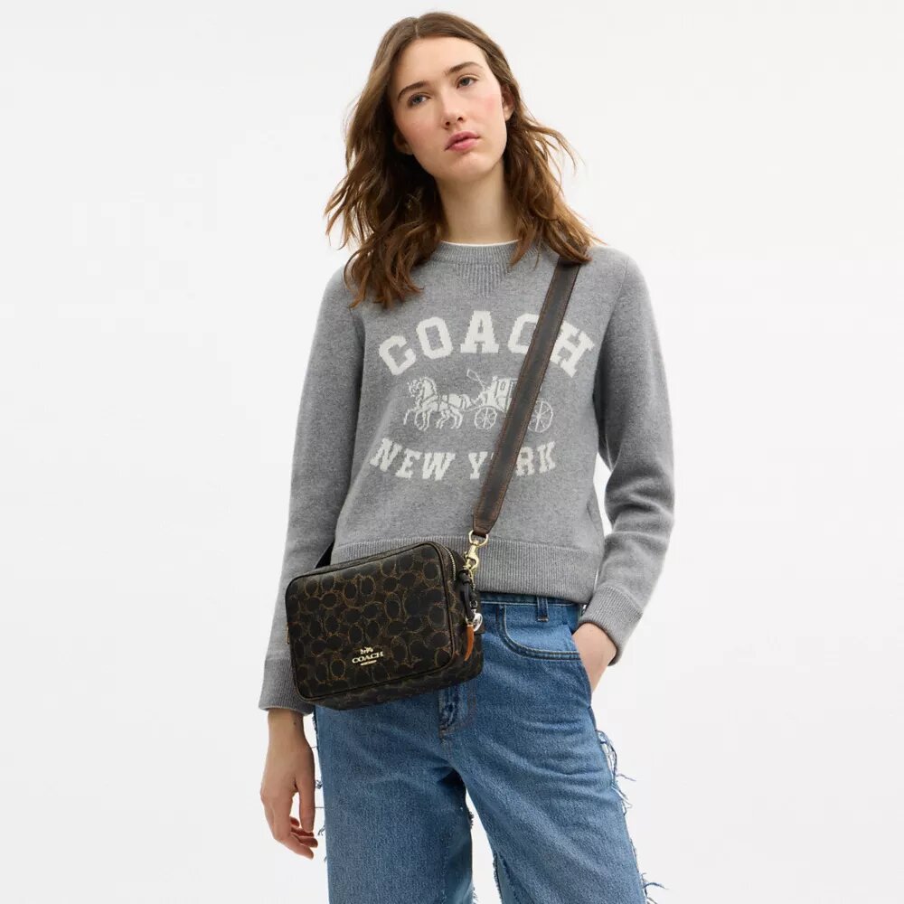 Carey-crossbodytas van het ‘Loved’ Signature Canvas met bedels