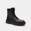 Combat boots with a distinctive jacquard pattern