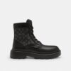 Combat boots with a distinctive jacquard pattern