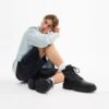 Combat boots with a distinctive jacquard pattern