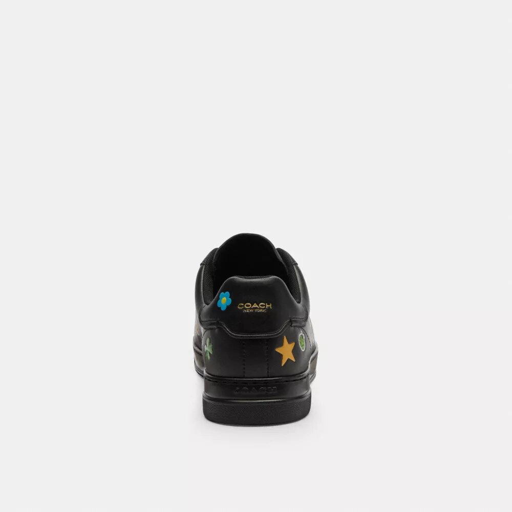 Disney X Coach Hoge sneakers met stickerprint