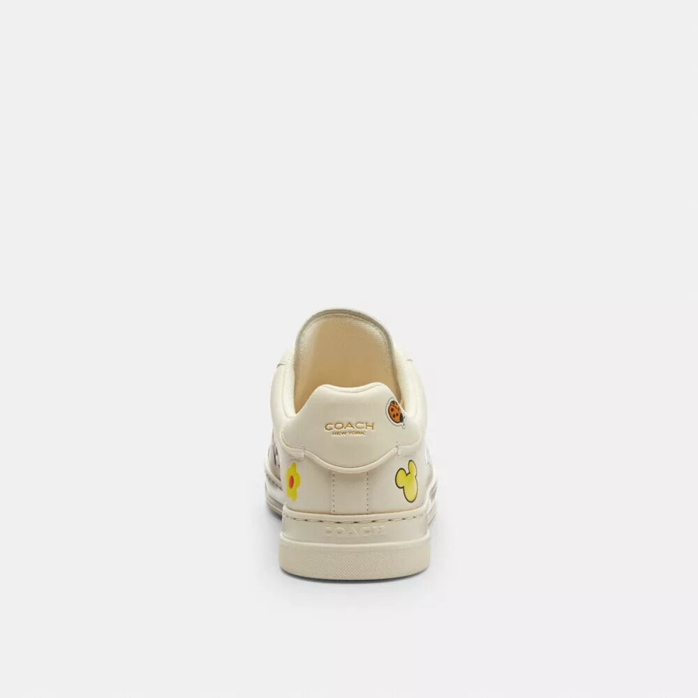 Disney X Coach Hoge sneakers met stickerprint