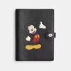 Disney X Coach-notitieboekje van regeneratief leer met Mickey Mouse