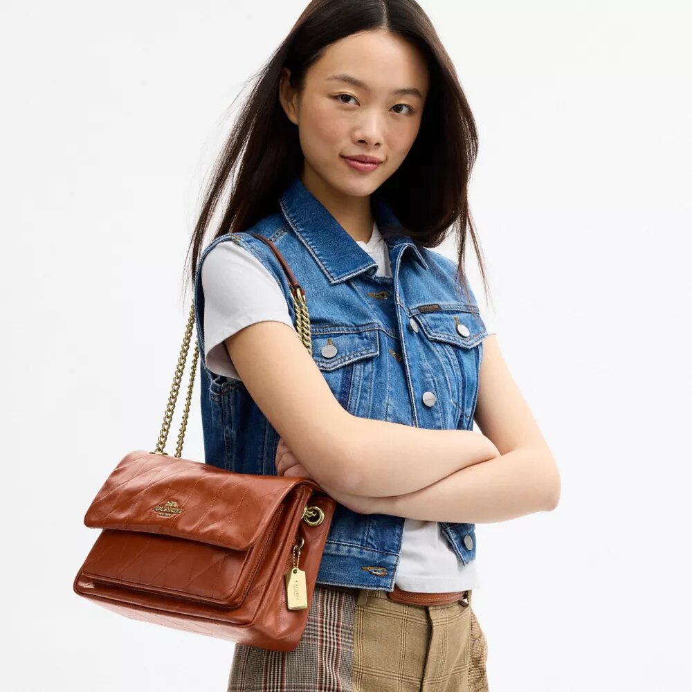 Elodie-crossbodytas met doorgestikt patroon