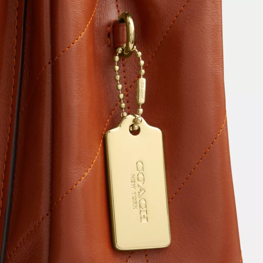 Elodie-crossbodytas met doorgestikt patroon