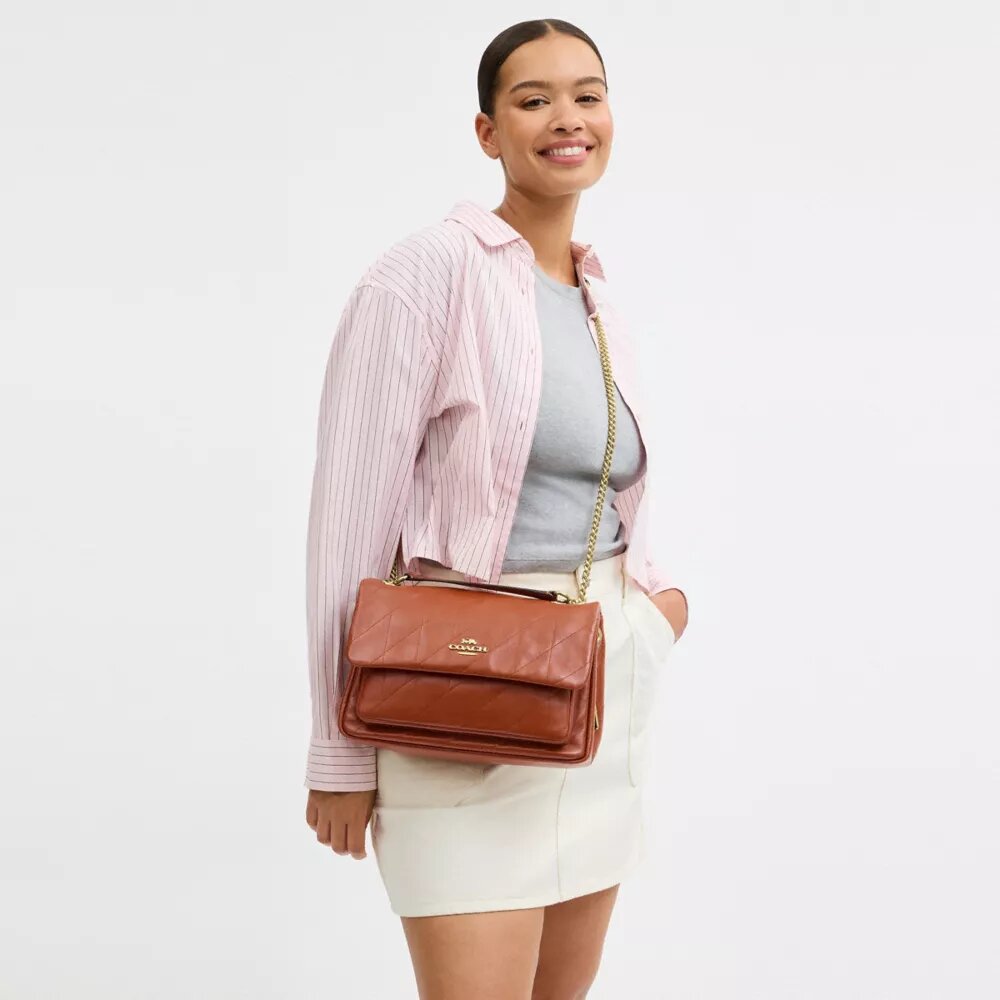 Elodie-crossbodytas met doorgestikt patroon