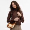 Emily-schoudertas van haarkalfsleer met koeienprint