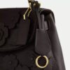 Emory-tas met handvat en bloemenapplicatie