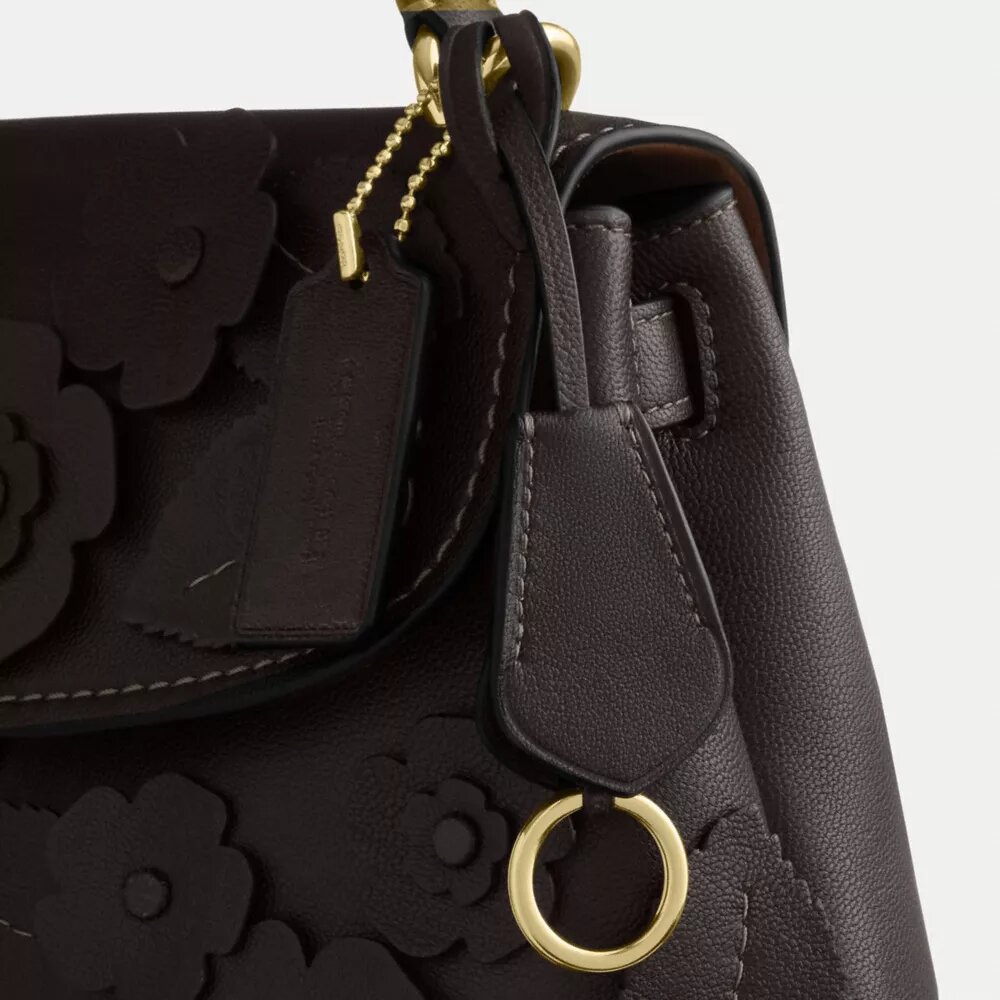 Emory-tas met handvat en bloemenapplicatie