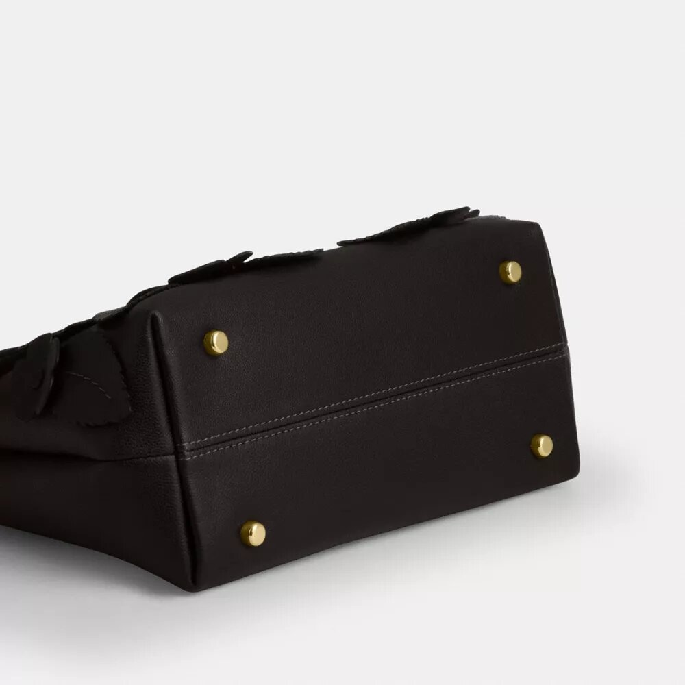 Emory-tas met handvat en bloemenapplicatie