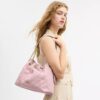 Evelyn-schoudertas in ‘Loved Denim’ met doorgestikt patroon en bedels