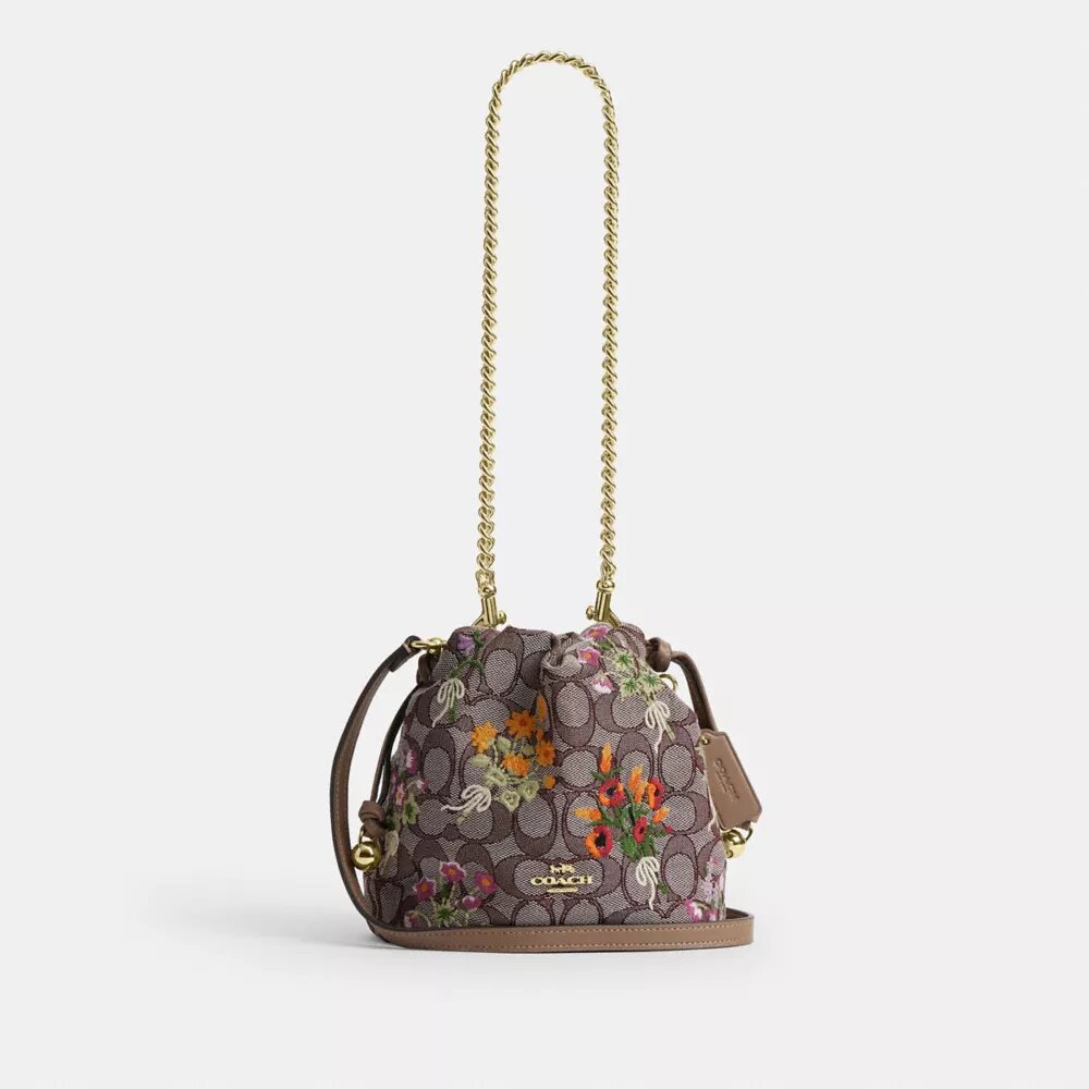 Faye Minitas met trekkoord in kenmerkend jacquard met bloemenborduursel