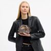 Faye Minitas met trekkoord in kenmerkend jacquard met bloemenborduursel