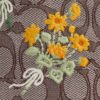 Faye Minitas met trekkoord in kenmerkend jacquard met bloemenborduursel