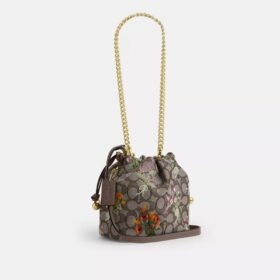 Faye Minitas met trekkoord in kenmerkend jacquard met bloemenborduursel