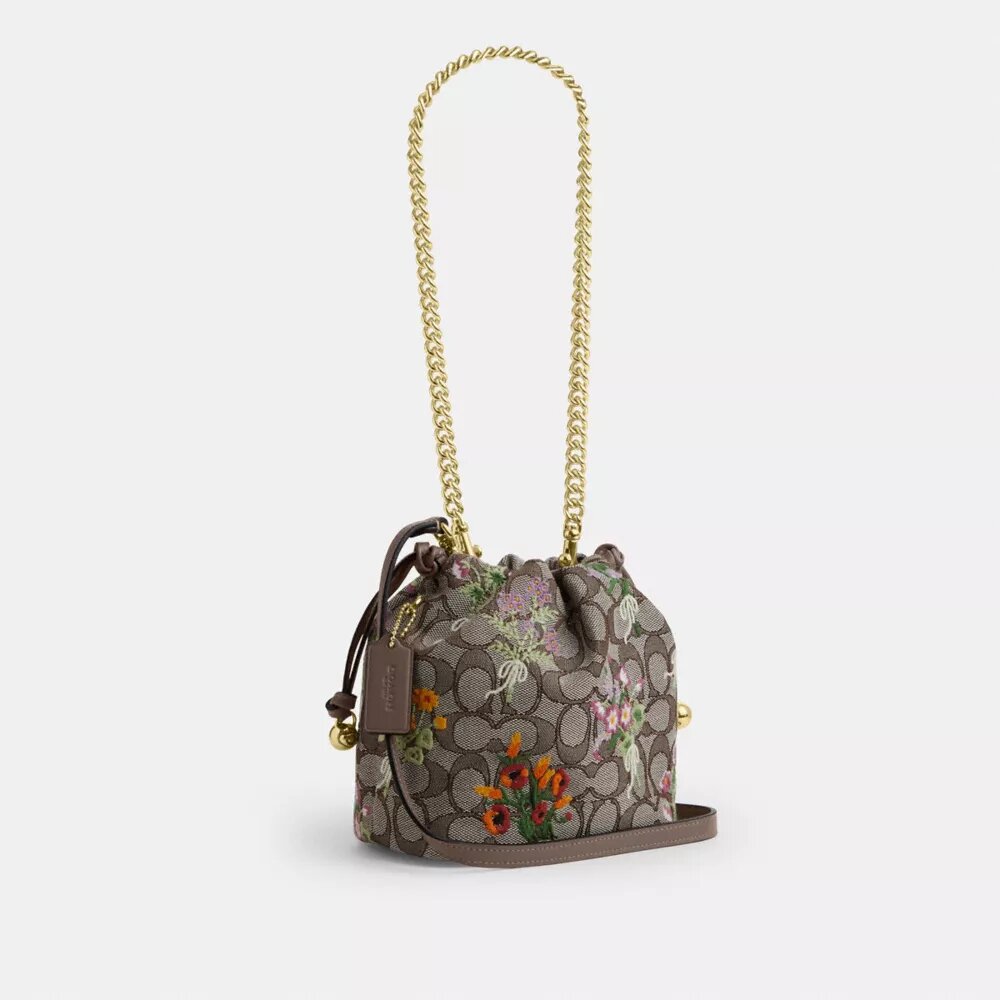 Faye Minitas met trekkoord in kenmerkend jacquard met bloemenborduursel