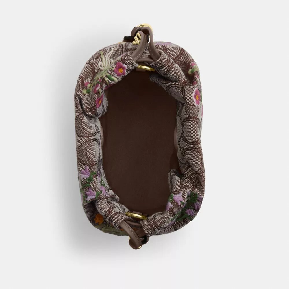 Faye Minitas met trekkoord in kenmerkend jacquard met bloemenborduursel