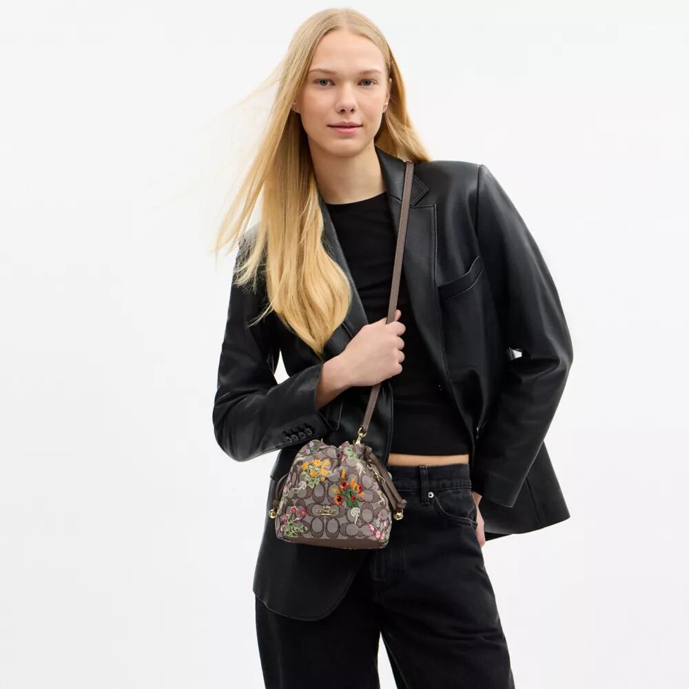 Faye Minitas met trekkoord in kenmerkend jacquard met bloemenborduursel