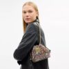 Faye Minitas met trekkoord in kenmerkend jacquard met bloemenborduursel
