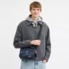 Graham-crossbodytas in kenmerkende camouflageprint