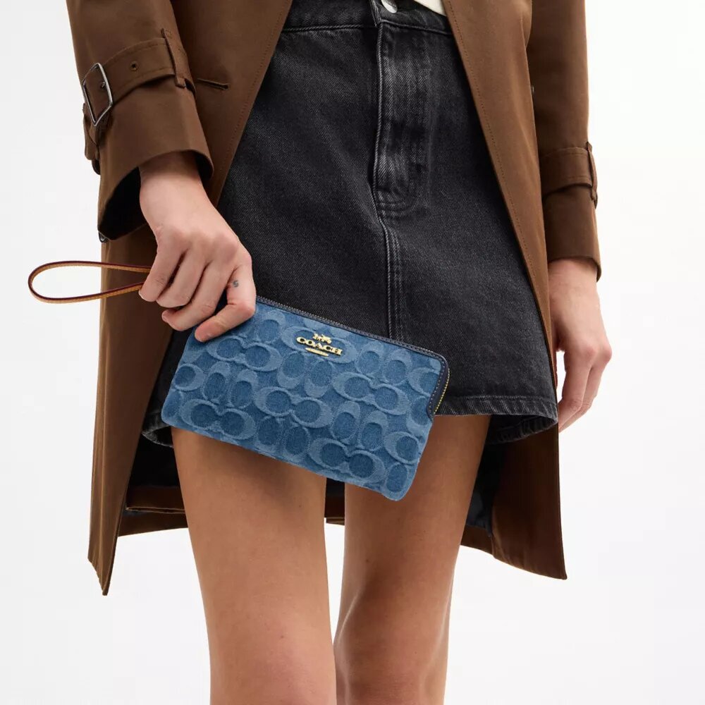 Grote polbandtasjes met rits in de hoek in kenmerkend denim