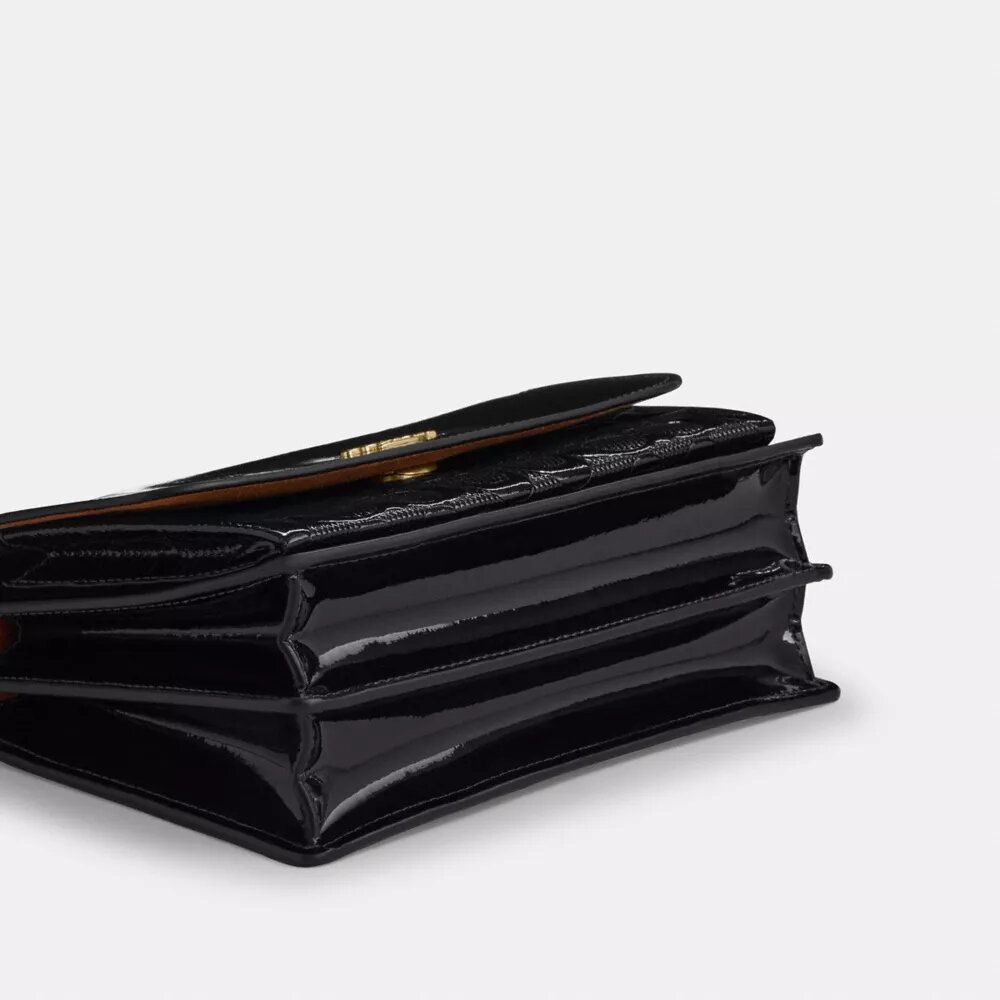 Klare crossbodytas van kenmerkend leer