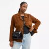 Klare crossbodytas van kenmerkend leer