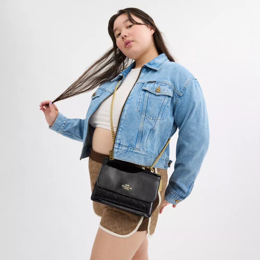 Klare crossbodytas van kenmerkend leer