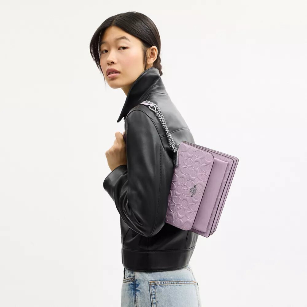 Klare crossbodytas van kenmerkend leer