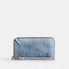 Lange portemonnee met rits rondom in ‘Loved’ denim