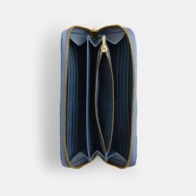 Lange portemonnee met rits rondom in ‘Loved’ denim