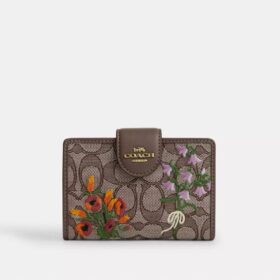 Middelgrote hoekportemonnee met ritssluiting in kenmerkend jacquard met bloemenborduursel