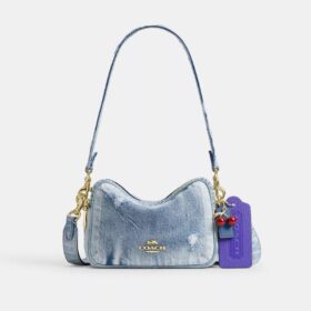 Mini Carey-crossbodytas in ‘Loved Denim’ met bedels