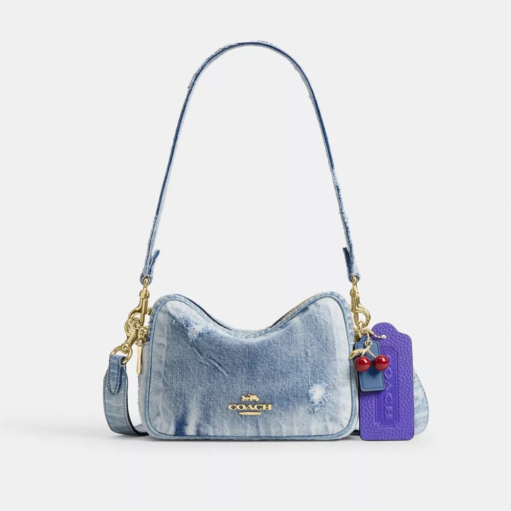 Mini Carey-crossbodytas in ‘Loved Denim’ met bedels