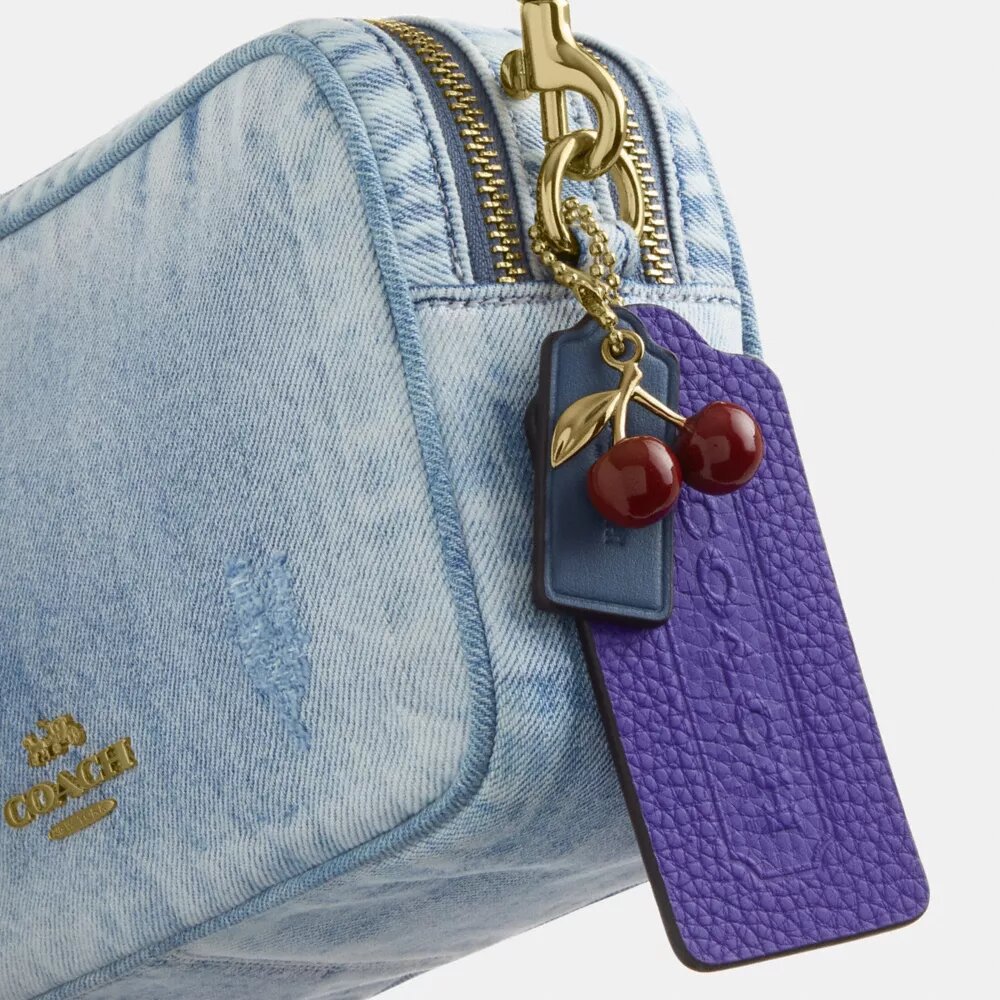 Mini Carey-crossbodytas in ‘Loved Denim’ met bedels