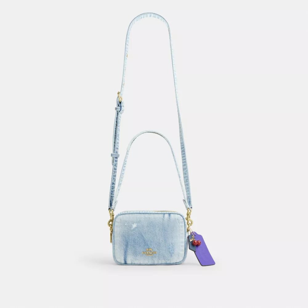 Mini Carey-crossbodytas in ‘Loved Denim’ met bedels