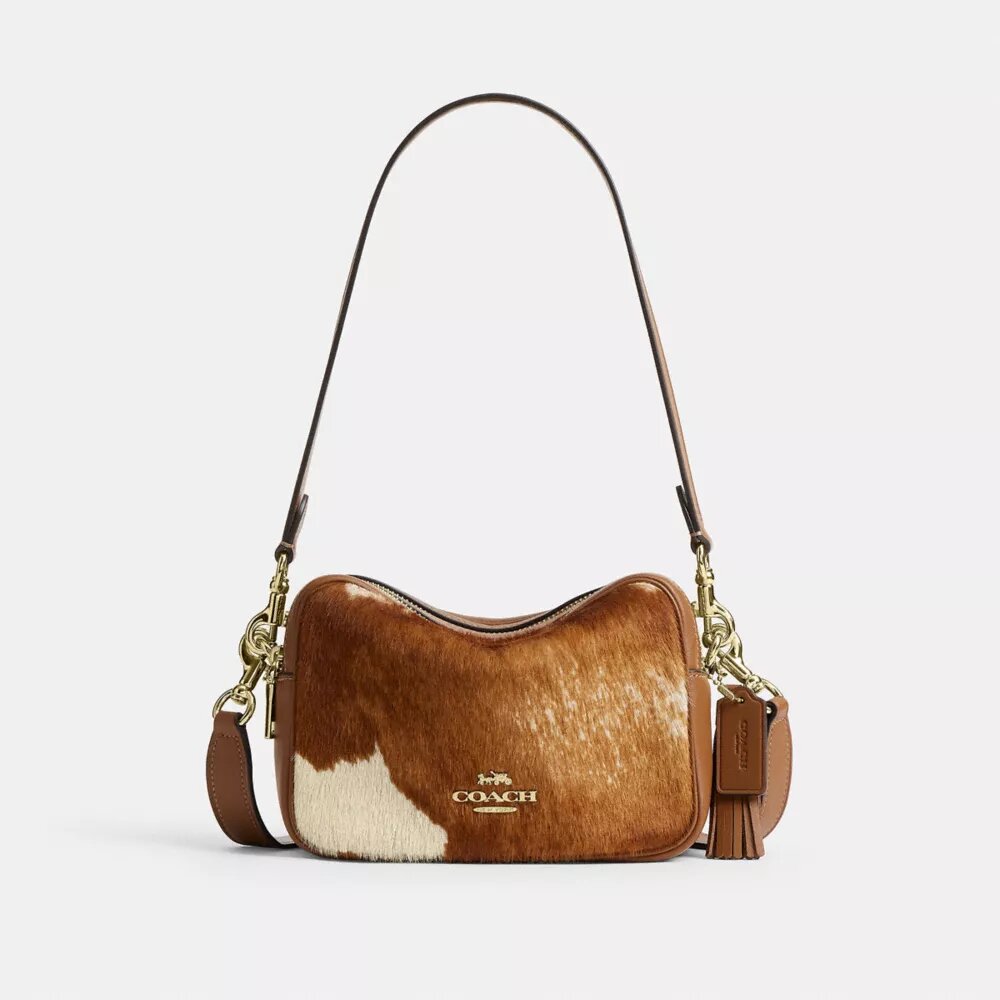 Mini Carey-crossbodytas van haarkalfsleer met koeienprint