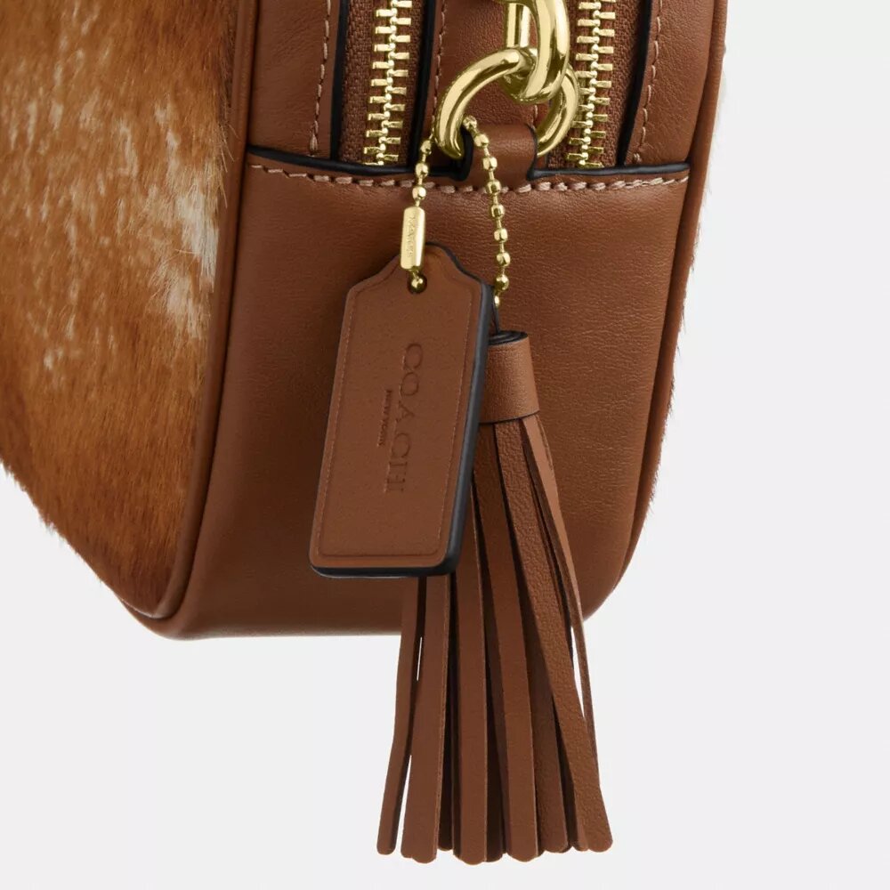 Mini Carey-crossbodytas van haarkalfsleer met koeienprint