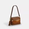 Mini Carey-crossbodytas van haarkalfsleer met koeienprint