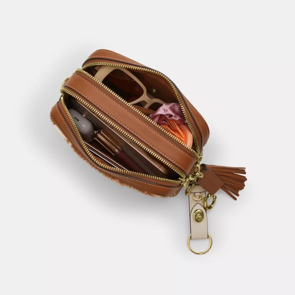 Mini Carey-crossbodytas van haarkalfsleer met koeienprint
