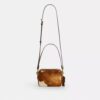 Mini Carey-crossbodytas van haarkalfsleer met koeienprint