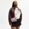 Mini Klare-crossbodytas van kenmerkend leer