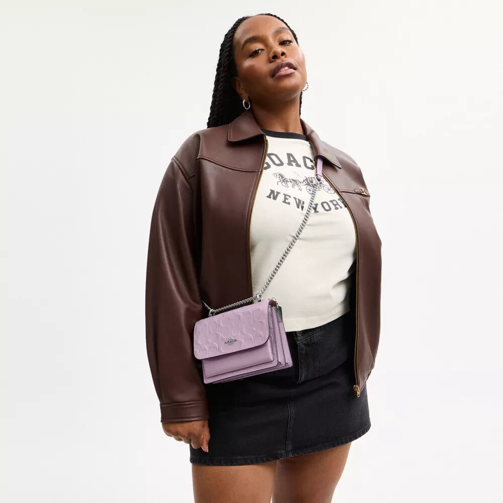 Mini Klare-crossbodytas van kenmerkend leer