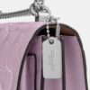 Mini Klare-crossbodytas van kenmerkend leer
