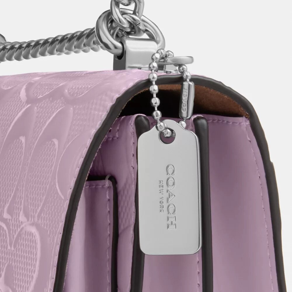 Mini Klare-crossbodytas van kenmerkend leer