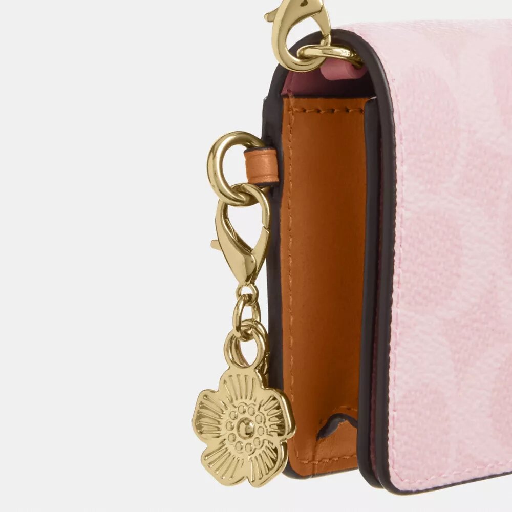 Mini-portemonnee aan een ketting van Signature Canvas met bedels